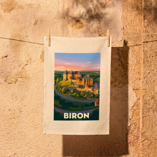 Torchon souvenir de la ville de Biron avec une illustration stylisée.