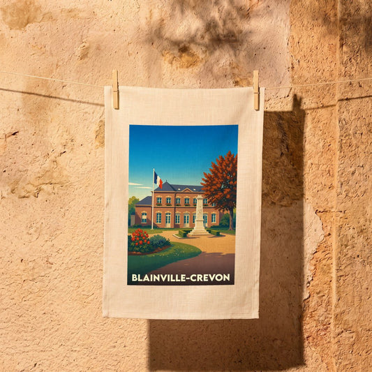 Torchon souvenir de la ville de Blainville-Crevon avec une illustration stylisée d'un bâtiment communal sous un ciel bleu.