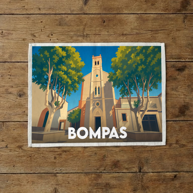 Torchon souvenir de la ville de Bompas avec une illustration stylisée de son église et de ses platanes.
