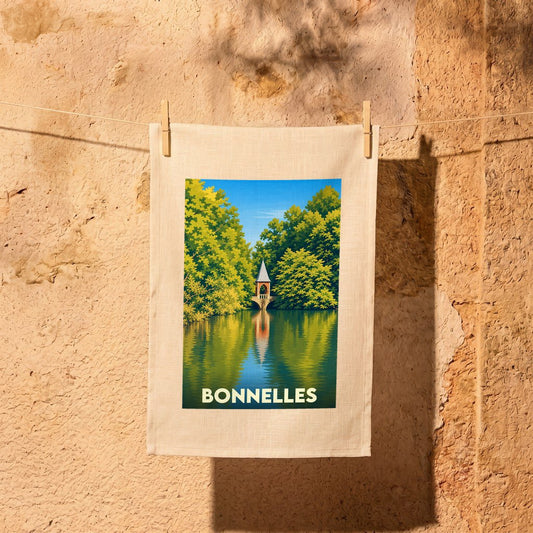 Torchon souvenir de la ville de Bonnelles avec une illustration stylisée d'un petit pavillon au bord de l'eau.