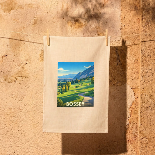 Torchon souvenir de la ville de Bossey orné d'une illustration stylisée de son paysage de montagne.