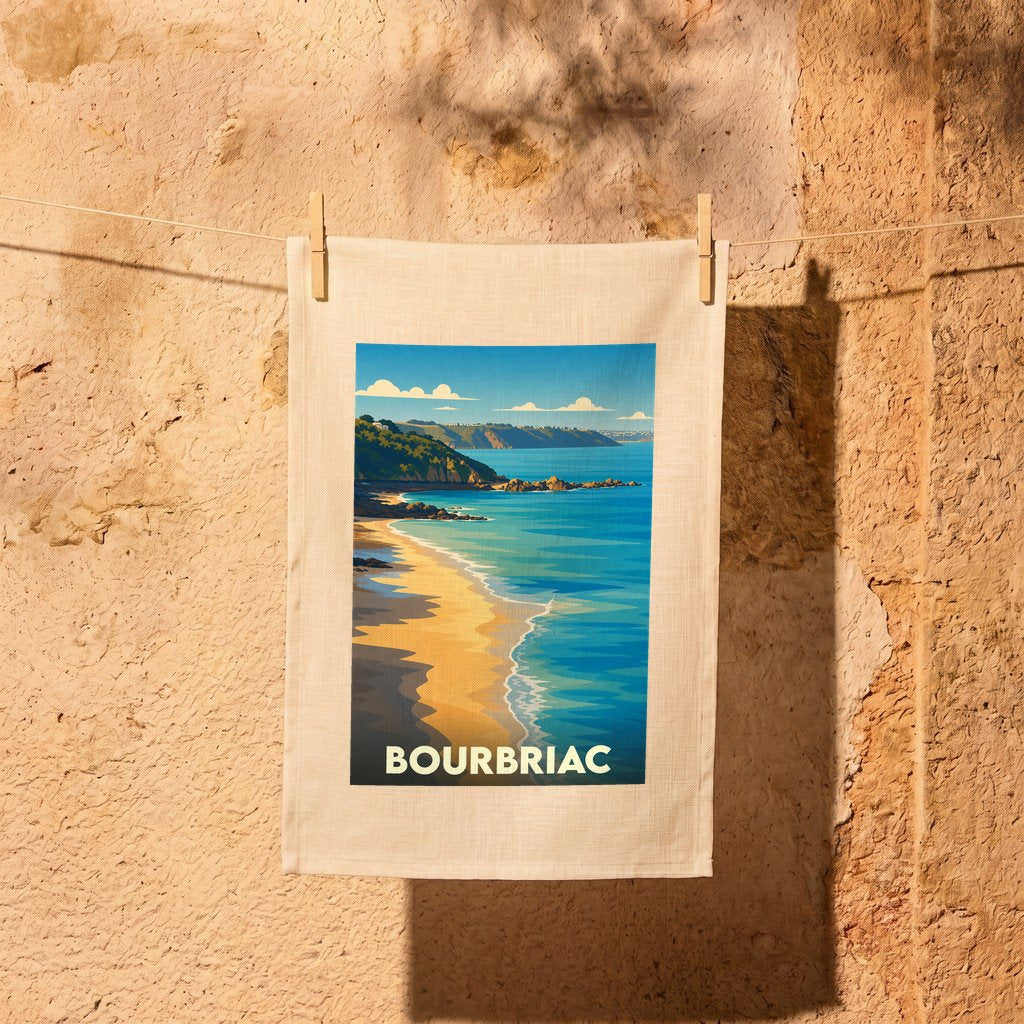 Torchon souvenir de la ville de Bourbriac avec une illustration stylisée de bord de mer.