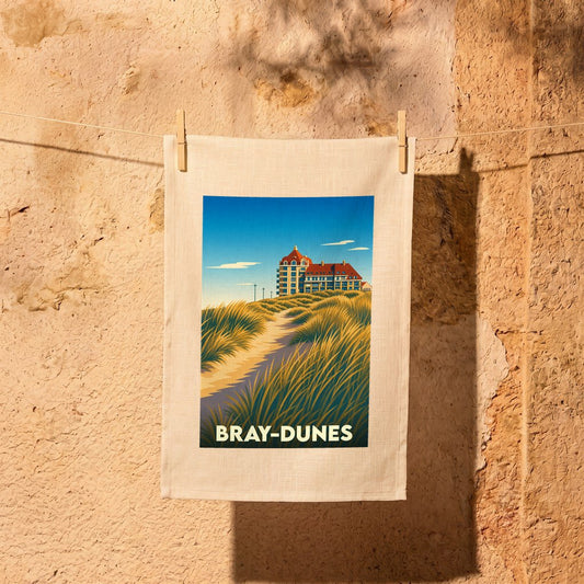 Torchon souvenir de la ville de Bray-Dunes orné d'une illustration stylisée de ses dunes et de son architecture.