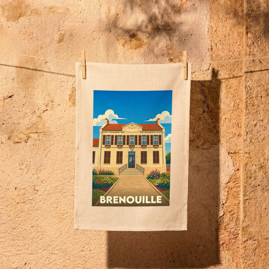 Torchon souvenir de la ville de Brenouille illustré d'un dessin stylisé de sa mairie.