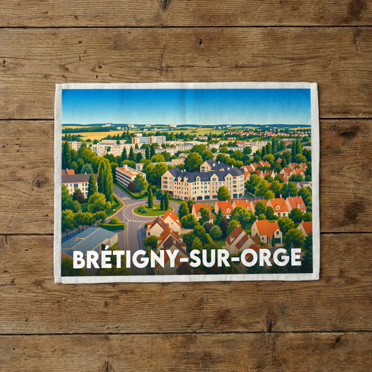 Torchon souvenir de la ville de Brétigny-sur-Orge avec une illustration stylisée d'un paysage urbain verdoyant.