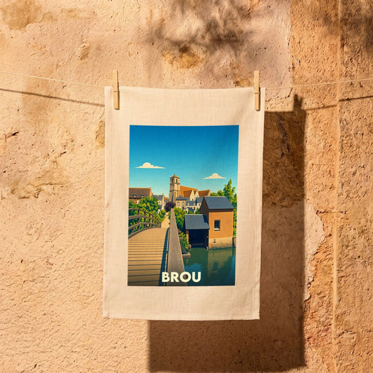 Torchon souvenir de la ville de Brou avec une illustration stylisée d'un pont et d'une église.