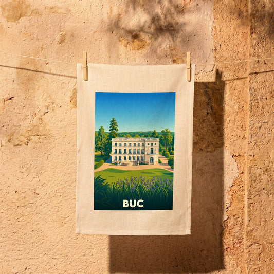 Torchon souvenir de la ville de Buc avec une illustration stylisée de son château.