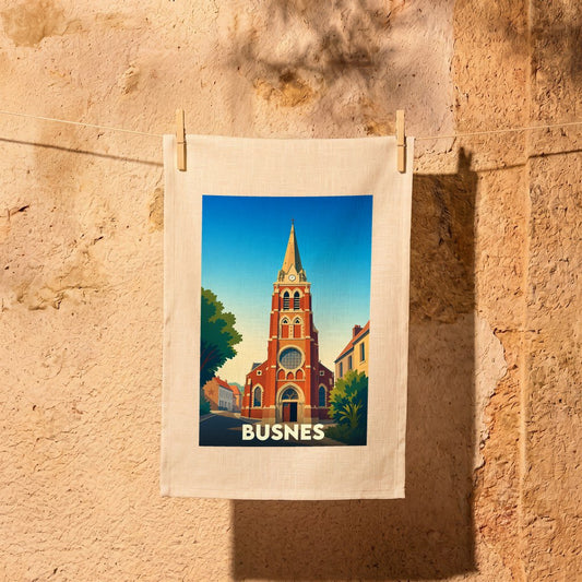 Torchon souvenir de la ville de Busnes orné d'une illustration stylisée de son église.