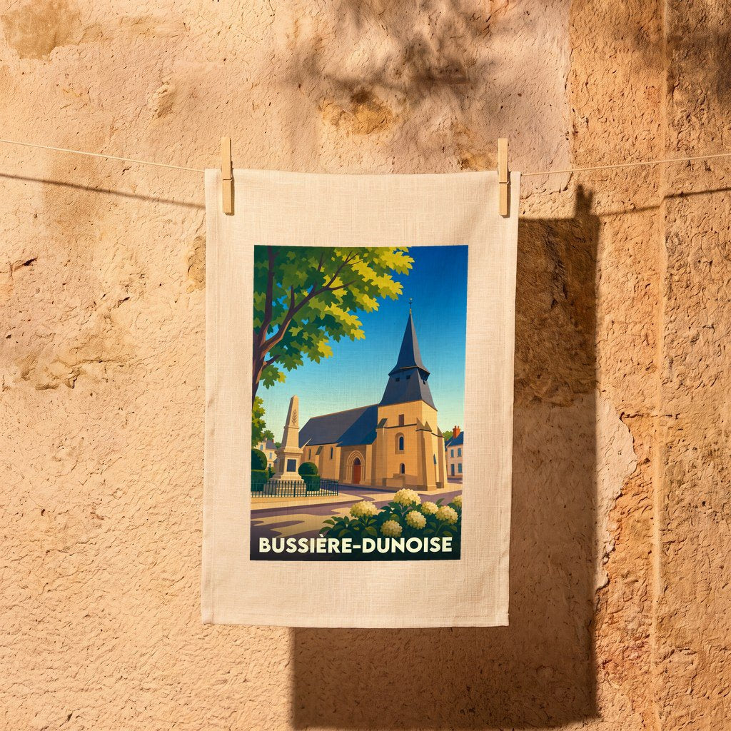 Torchon souvenir de la ville de Bussière-Dunoise avec une illustration stylisée de son église et d'un monument.