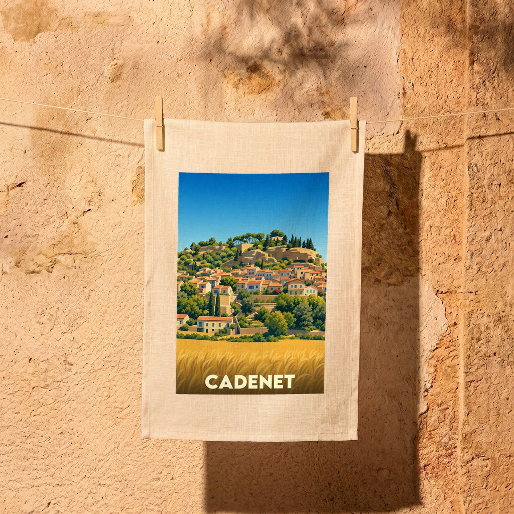 Torchon souvenir de la ville de Cadenet illustré d'un paysage provençal stylisé.