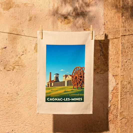 Torchon souvenir de la ville de Cagnac-les-Mines avec une illustration stylisée de son patrimoine minier.