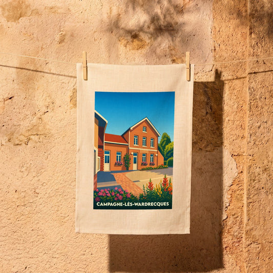Torchon souvenir de la ville de Campagne-lès-Wardrecques avec une illustration stylisée d'une maison en briques.