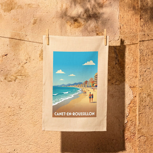 Torchon souvenir de la ville de Canet-en-Roussillon avec une illustration stylisée de sa plage.