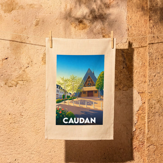 Torchon souvenir de la ville de Caudan avec une illustration stylisée de son église moderne et du centre-ville.