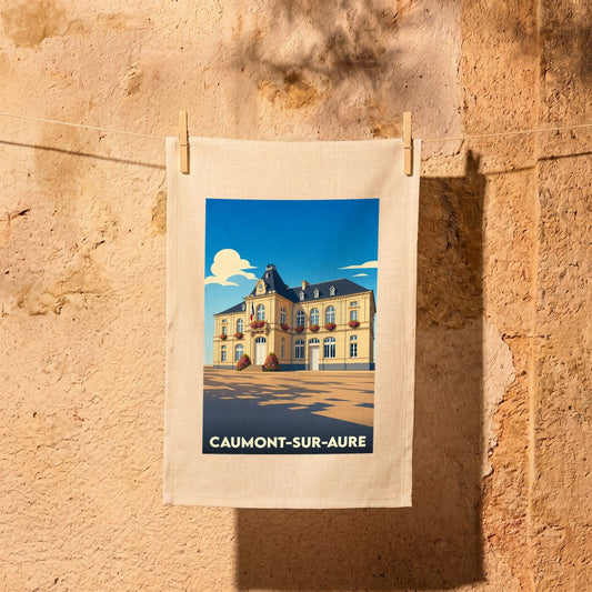 Torchon souvenir de la ville de Caumont-sur-Aure avec une illustration stylisée de sa mairie.