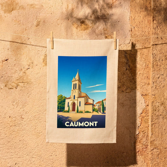 Torchon souvenir de la ville de Caumont avec une illustration stylisée de son église.