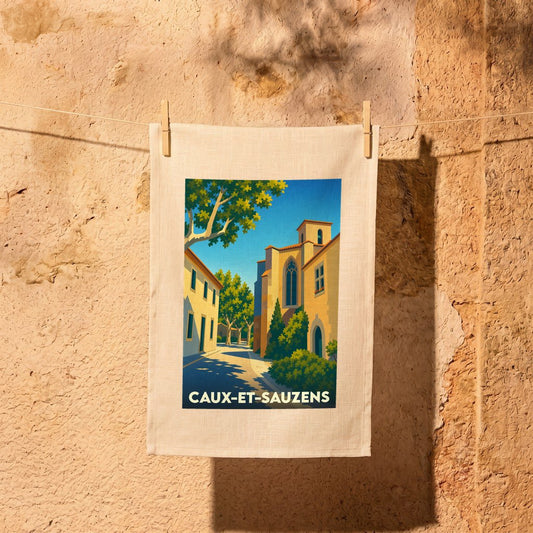 Torchon souvenir de la ville de Caux-et-Sauzens avec une illustration stylisée.