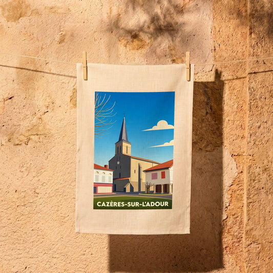 Torchon souvenir de la ville de Cazères-sur-l'Adour avec une illustration stylisée de son église.
