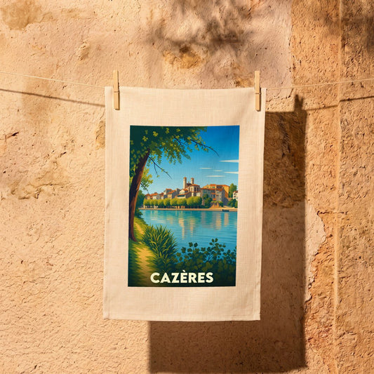 Torchon souvenir de la ville de Cazères avec une illustration stylisée représentant les quais de la Garonne.