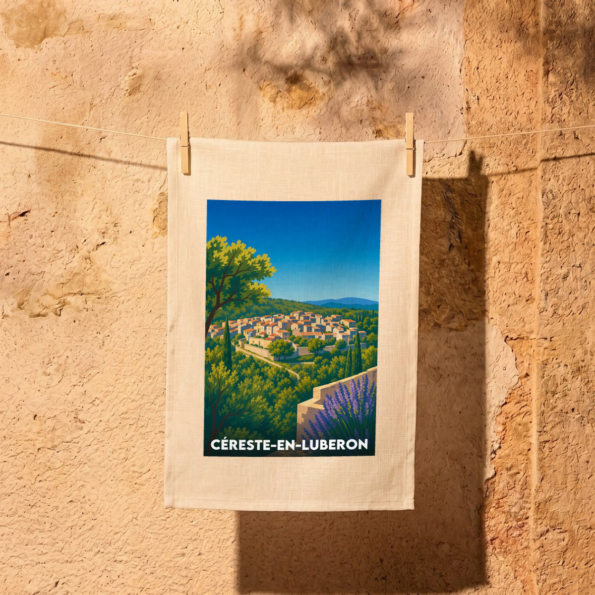 Torchon souvenir de la ville de Céreste-en-Luberon avec une illustration stylisée.