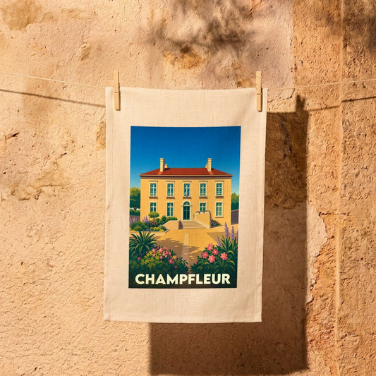 Torchon souvenir de la ville de Champfleur illustré d'une demeure provençale stylisée.