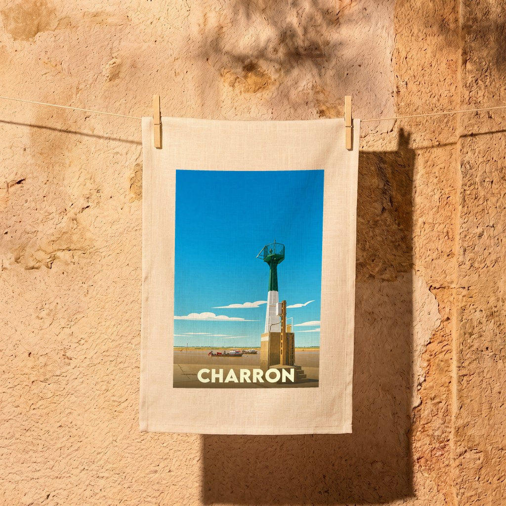 Torchon souvenir de la ville de Charron avec une illustration stylisée de son phare côtier.