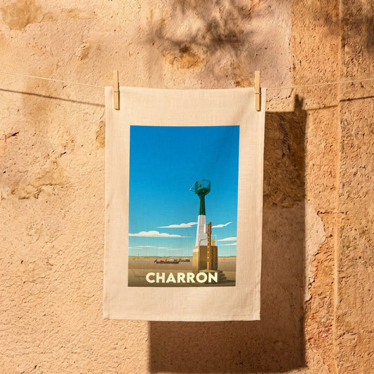 Torchon souvenir de la ville de Charron avec une illustration stylisée de son phare côtier.