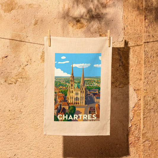 Torchon souvenir de la ville de Chartres avec une illustration stylisée de sa cathédrale.