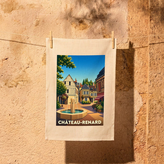 Torchon souvenir de la ville de Château-Renard avec une illustration stylisée d'une place provençale et sa fontaine.