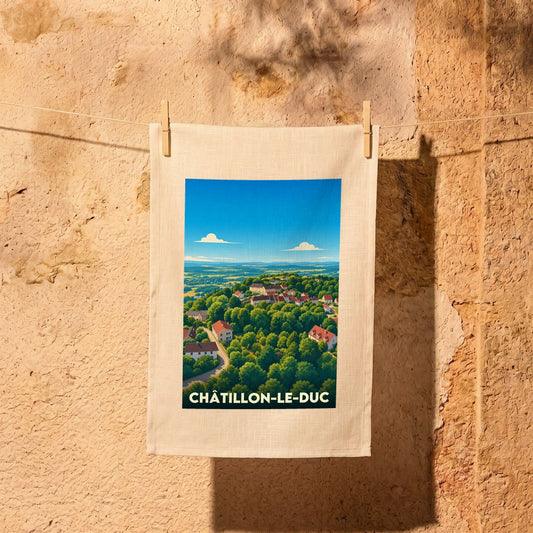 Torchon souvenir de la ville de Châtillon-le-Duc avec une illustration stylisée d'un paysage verdoyant.