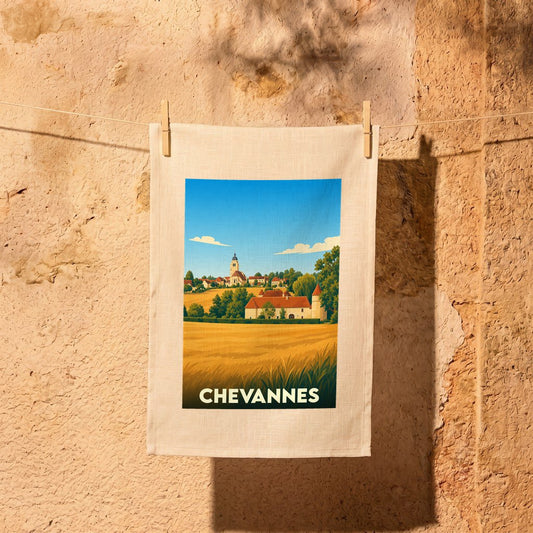 Torchon souvenir de la ville de Chevannes illustrant un paysage de campagne stylisé.
