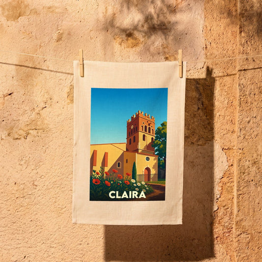 Torchon souvenir de la ville de Claira avec une illustration stylisée d'une église sous un ciel bleu.