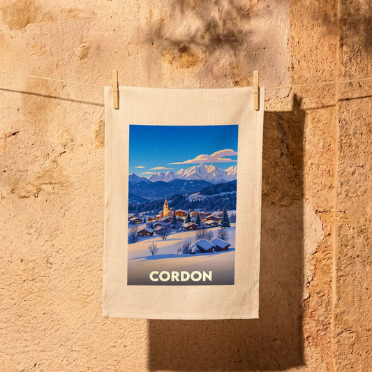 Torchon souvenir de la ville de Cordon avec une illustration hivernale stylisée.