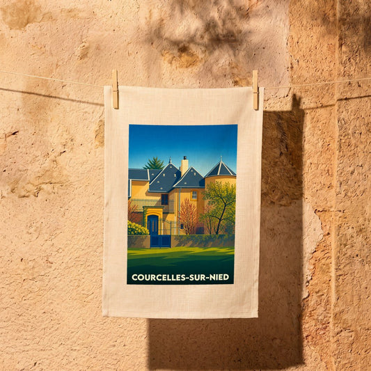 Torchon souvenir de la ville de Courcelles-sur-Nied avec une illustration stylisée.