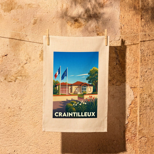 Torchon souvenir de la ville de Craintilleux avec une illustration stylisée.