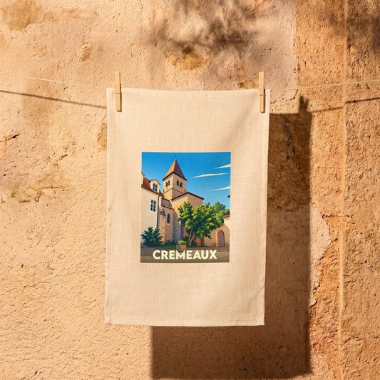 Torchon souvenir de la ville de Cremeaux avec une illustration stylisée.