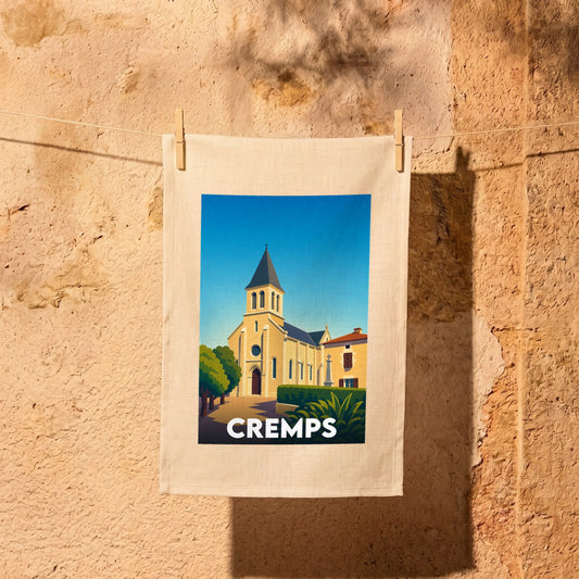 Torchon souvenir de la ville de Cremps avec une illustration stylisée de son église.