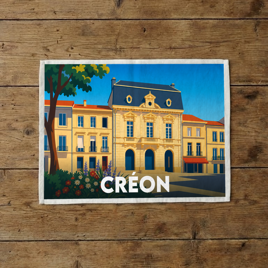 Torchon souvenir de la ville de Créon avec une illustration stylisée de son architecture.