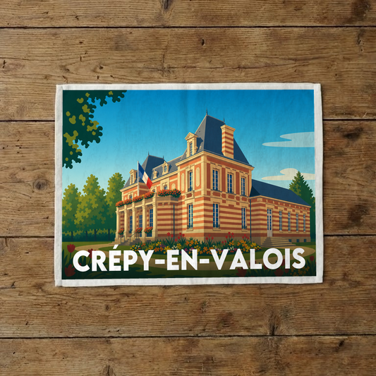 Torchon souvenir de la ville de Crépy-en-Valois avec une illustration stylisée d'un bâtiment historique.