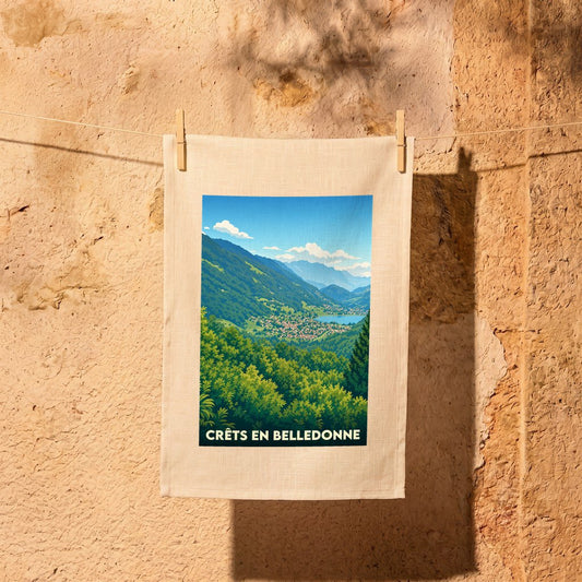 Torchon souvenir de la ville de Crêts en Belledonne avec une illustration paysagère stylisée.