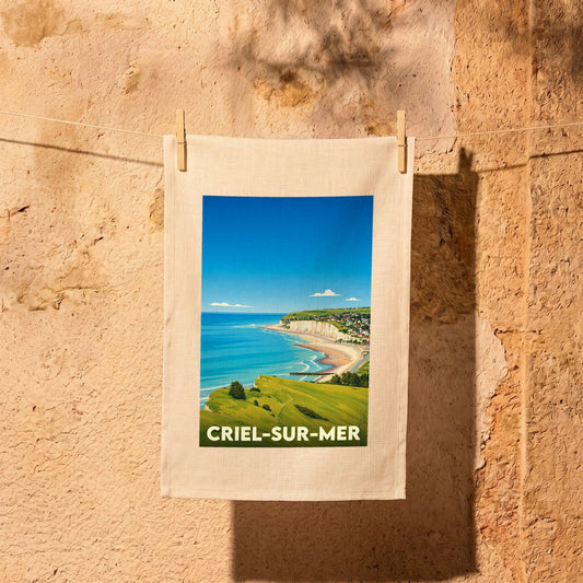 Torchon souvenir de la ville de Criel-sur-Mer avec une illustration stylisée de son littoral.