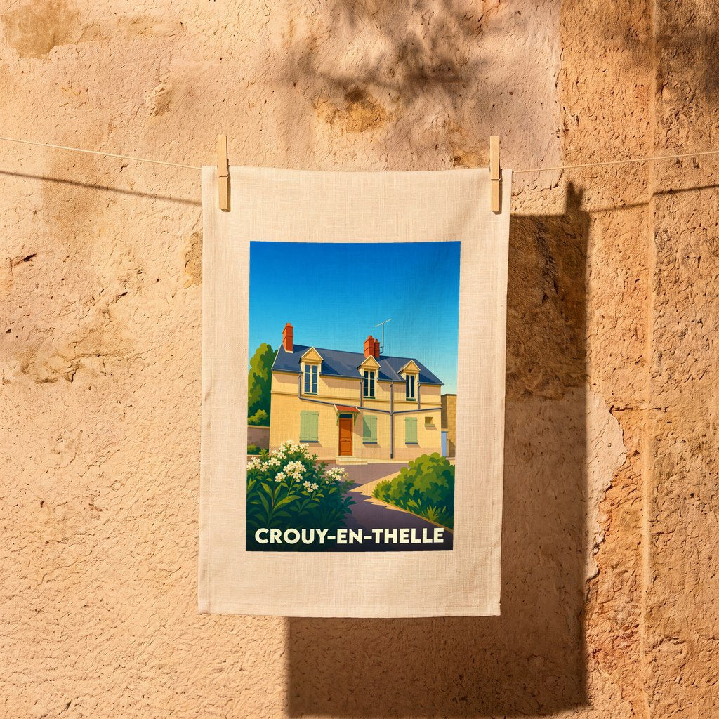 Torchon souvenir de la ville de Crouy-en-Thelle illustré d'une maison de campagne stylisée.