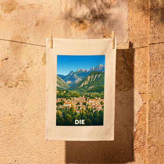 Torchon souvenir de la ville de Die orné d'une illustration stylisée de ses paysages montagneux.