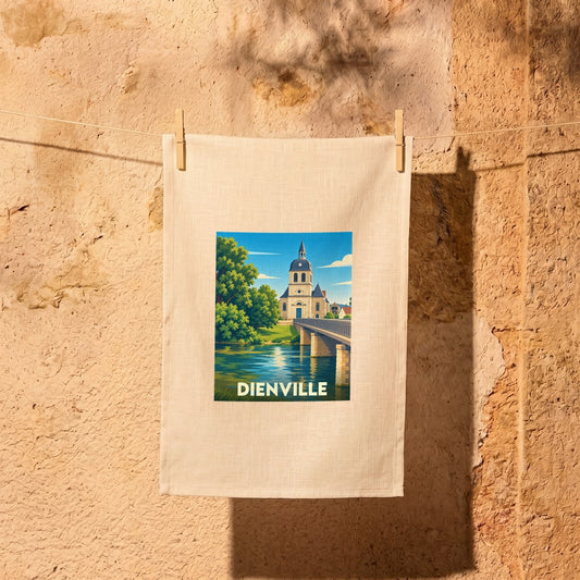 Torchon souvenir de la ville de Dienville illustré d'une église et d'un pont au bord de l'eau.