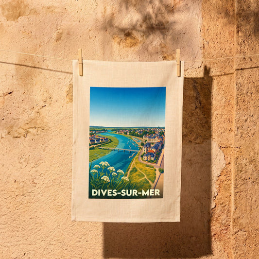Torchon souvenir de la ville de Dives-sur-Mer avec une illustration stylisée d'un paysage côtier normand.