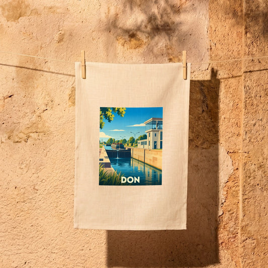 Torchon souvenir de la ville de Don avec une illustration stylisée de son écluse.