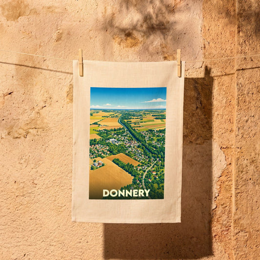 Torchon souvenir de la ville de Donnery illustré par une vue aérienne stylisée de ses paysages et habitations.