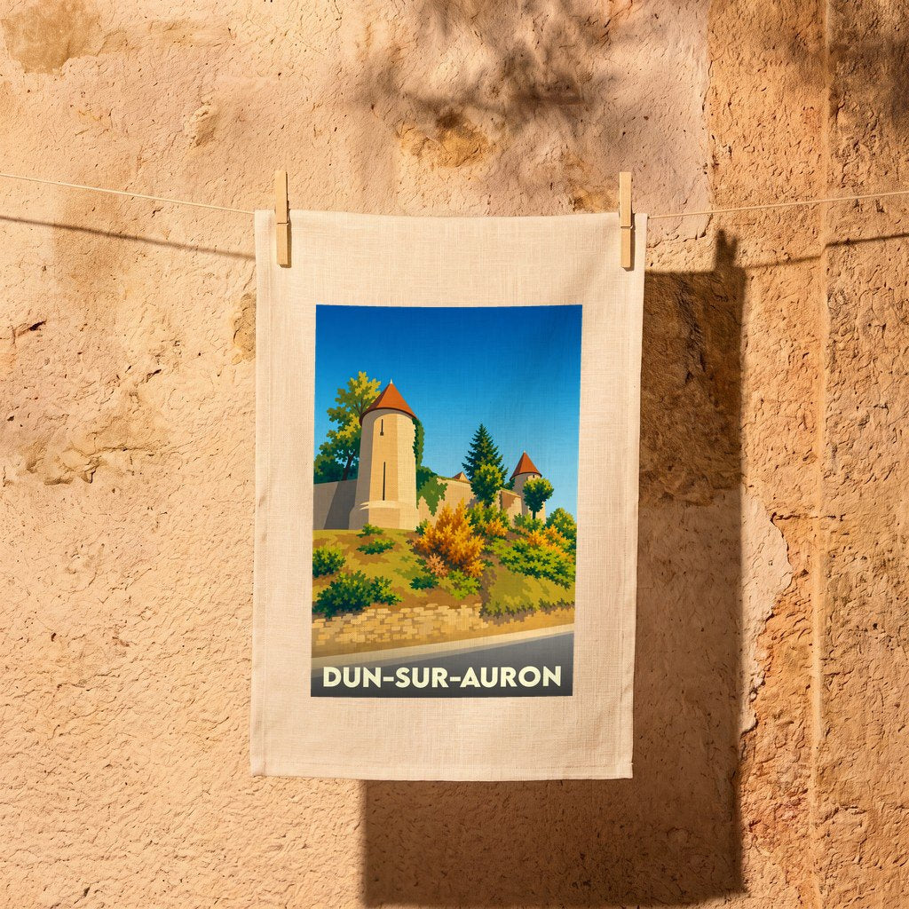Torchon souvenir de la ville de Dun-sur-Auron avec une illustration stylisée de ses remparts médiévaux.