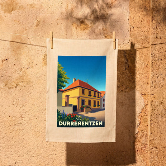 Torchon souvenir de la ville de Durrenentzen avec une illustration stylisée d'une maison alsacienne traditionnelle.