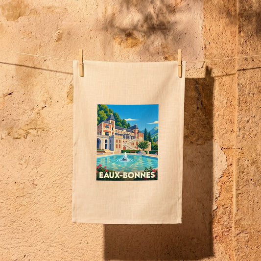 Torchon souvenir de la ville de Eaux-Bonnes avec une illustration stylisée d'un palais et de son bassin.